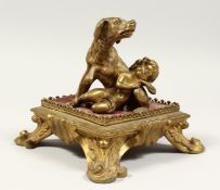A GOOD 19TH CENTURY BRONZE GROUP, A DOG AND A SMALL CHILD on a square base. 6ins wide.