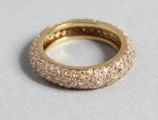 A YELLOW GOLD PAVE SET DIAMOND ETERNITY RING