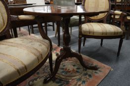A George III mahogany circular tilt top tripod table.