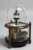A SMALL GLASS DOMED FISH CLOCK.
