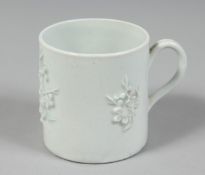 A GOOD EARLY BOW BLANC DE CHINE CAN with applied sprigs of prunus.