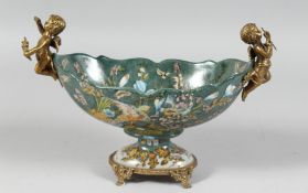 A CONTINENTAL PORCELAIN OVAL PEDESTAL BOWL with bronze cupids. 11ins long.