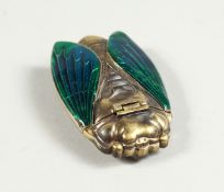 A BRASS SCARAB VESTA CASE.