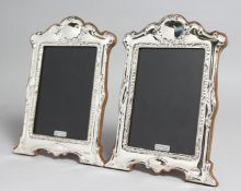 A PAIR OF SILVER PHOTOGRAPH FRAMES. 7.5ins x 5.5ins.