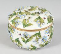 A DRESDEN CIRCULAR FLOWER ENCRUSTED BOWL AND COVER. 4ins diameter.