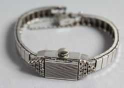 A 14CT WHITE LAFEMME ART DECO DIAMOND SET COCKTAIL WATCH.