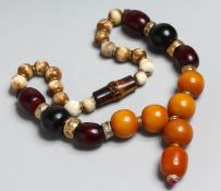 A LARGE AMBER AND STONE NECKLACE.