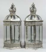 A PAIR OF SILVERED LANTERNS. 2ft high.