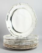 A SET OF TWELVE PLATED PIE CRUST PLATES with gadrooned edge. 12ins diameter.