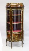 A GOOD LOUIS XVI STYLE KINGWOOD VITRINE (19TH CENTURY) with ormolu mounts, the top with bowed