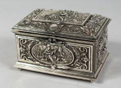 A. B. PARIS. A FINELY LINED AND CHASED CASKET with panels of figures. 6.5ins long.