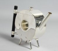 A CHRISTOPHER DRESSER DESIGN CIRCULAR, WITH A HOLE, PLATED TEAPOT.