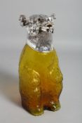 A YELLOW GLASS BEAR CLARET JUG with plated head.