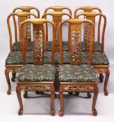A GOOD SET OF EIGHT CHINESE HARDWOOD CHAIRS, 20TH CENTURY with carved back splats, solid seat with