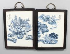A PAIR OF FRAMED CHINESE BLUE AND WHITE PLAQUES. 12ins x 10ins.