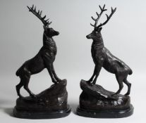 AFTER J. MOIGNIEZ. A PAIR OF STAGS on a rock. Signed, 16ins high.