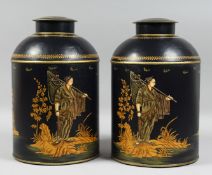 A PAIR OF TOLE WARE BLUE TEA TINS AND COVERS. 14ins high.