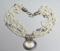 A DESIGNER NECKLACE with oval moonstones.