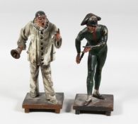 A PAINTED AUSTRIAN CLOWN with a hand bell, 10ins high and one of PIERROT 10ins high. (2).