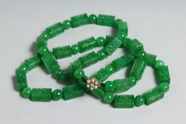 A SUPERB CHINESE JADE AND NECKLACE with gold diamond and pearl clasp.