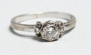 AN 18CT GOLD SOLITAIRE DIAMOND RING.