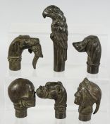 SIX BRONZE WALKING STICK HANDLES.