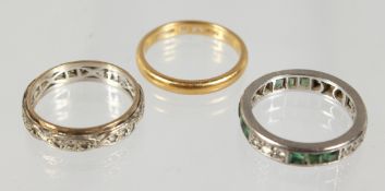 A 22 CARAT GOLD WEDDING BAND AND TWO ETERNITY RINGS (3).