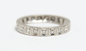 AN 18CT. WHITE GOLD AND DIAMOND ETERNITY RING.
