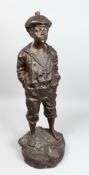 MARCEL AFTER V. SZEZE BLEWSKI. A LARGE BRONZE OF A YOUNG BOY WHISTLING. Signed 30ins high.