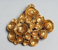 YVES ST LAURENT. SIGNED GILT BROOCH.