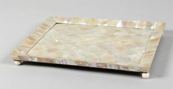 A GOOD MOTHER OF PEARL SHELL TRAY on bun feet. 11ins x 8.5ins