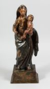 A GOOD POLYCHROME OAK MADONNA AND CHILD on a rectangular base. 16ins high.