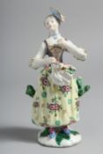 A BOW FIGURE OF A GIRL with flowers in her apron.