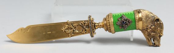 A SUPERB RUSSIAN SILVER GILT AND ENAMEL LETTER OPENER with boar's head, set with diamonds. Faberge