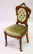 A VICTORIAN CARVED WALNUT AND UPHOLSTERED SINGLE CHAIR on turned legs.