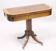 A SUPERB REGENCY ROSEWOOD CROSS BANDED FOLDING TOP CARD TABLE with brass mounts, centre column