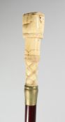 A CARVED BONE HANDLE WALKING STICK 