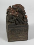 A CHINESE BRONZE DRAGON SQUARE SEAL. 5ins high.