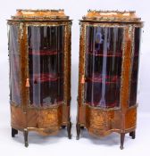 A GOOD PAIR OF 19TH CENTURY FRENCH MAHOGANY AND MARQUETRY VITRINES with metal mounts, shaped glass