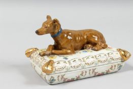 A PORCELAIN BOX AND COVER with a greyhound. 6ins long.