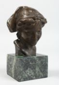A BRONZE BUST OF A YOUNG GIRL. Signed, 3.5ins on a marble plinth.