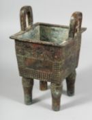 A GOOD ARCHAIC BRONZE CENSER with handles on four legs. 9ins high.