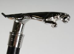 A JAGUAR WALKING STICK.