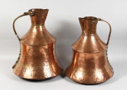TWO LARGE COPPER ISLAMIC JUGS 16ins high.