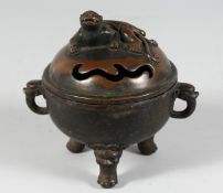 A CHINESE BRONZE CIRCULAR CENSER with dog of Foe, on three lion legs. 5ins diameter.