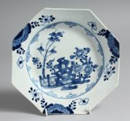A BOW PLATE painted in blue with a rock, fence and flower sprays, painted numeral 32 to the