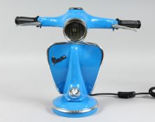 A BLUE VESPA LAMP.