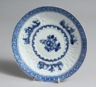 A BOW PLATE OR STAND finely moulded with pleats, flowers and three cartouches containing an oriental