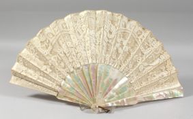 A GOOD VICTORIAN MOTHER OF PEARL AND LACE FAN. 20ins open, in a box. J Duvellerux, Paris & London.