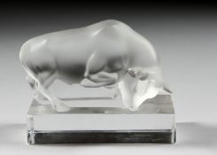 A FROSTED GLASS LALIQUE BULL on a reclining base. 4ins long